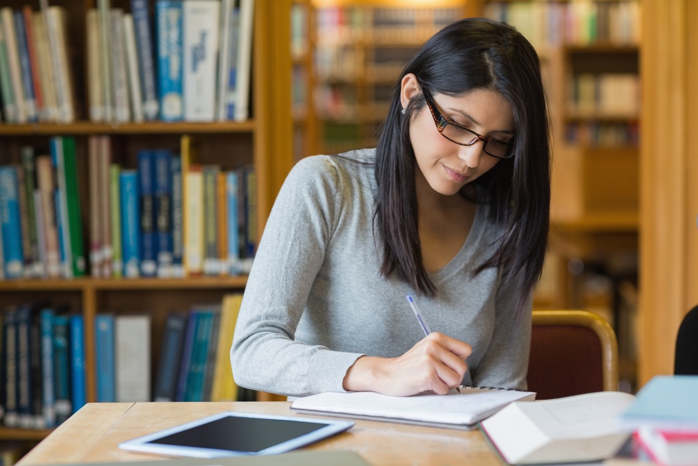 Non-Traditional Student Recruitment woman studying in the library.jpeg